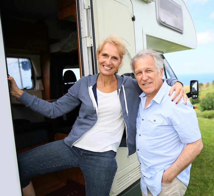 Happy Middle Aged Couple On Rv Steps Enjoying Their Rv Near Hillsborough County Florida