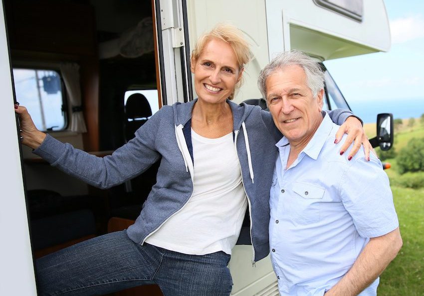 Happy Middle Aged Couple On Rv Steps Enjoying Their Rv Near Hillsborough County Florida